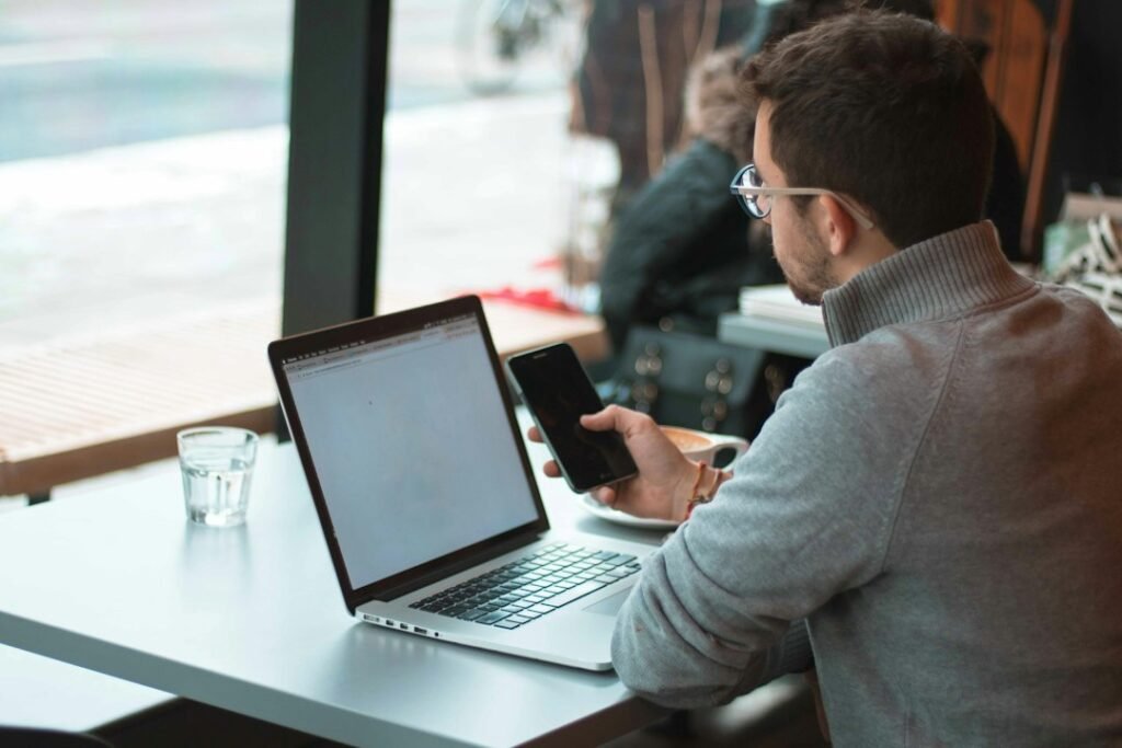 Freelancing Jobs: What They Are and How They Work - freelancer working on laptop at coffee shop