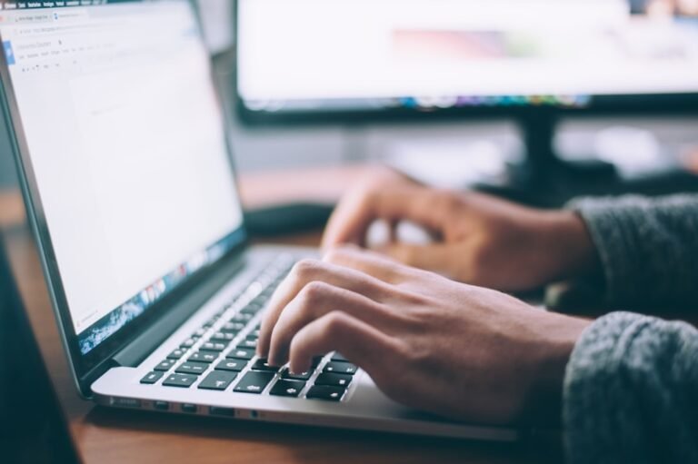 Is Domain Registration Worth It? Weighing Costs and Benefits - person typing a domain name into a registration form