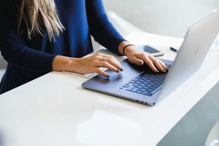 Guest Post Service Comparison: How to Pick the Best Provider - guest post writer at laptop