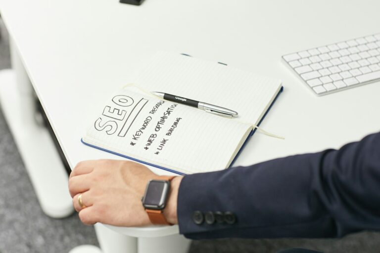Research Dossier for Target Company: Complete Guide & Template - SEO analyst reviewing spreadsheet