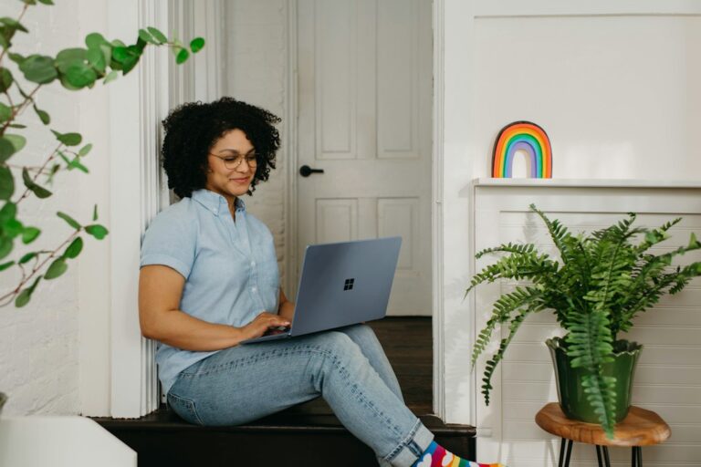 Zillow: How to Use Home Values for Smart Decisions - person looking at house price on laptop